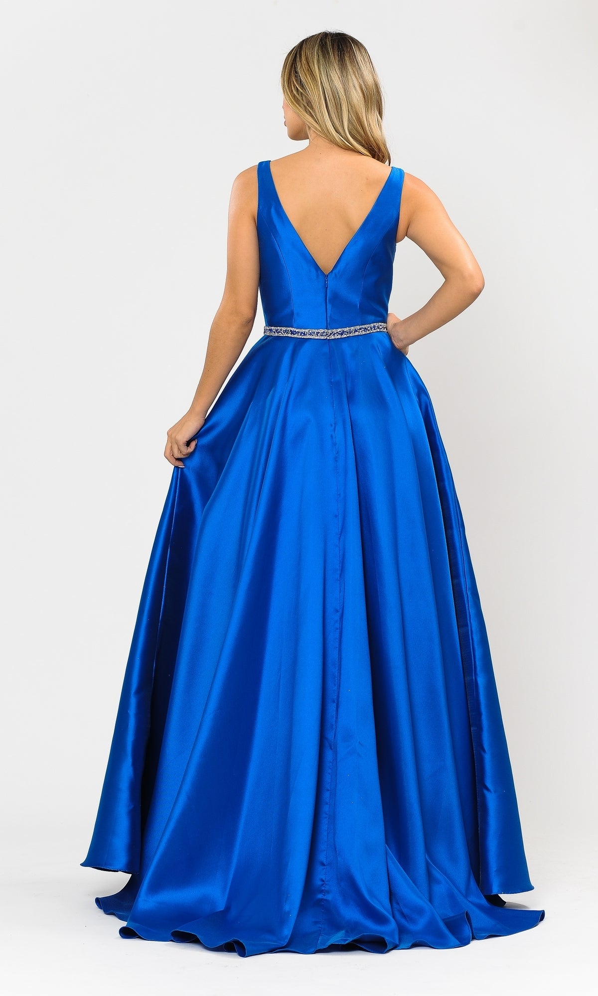 Woman wearing the Deep V-Neck Long Mikado A-Line Prom Dress 8682 in royal blue, featuring a sleeveless design, deep V-back, and beaded waistband, shown from behind against a plain white background.
